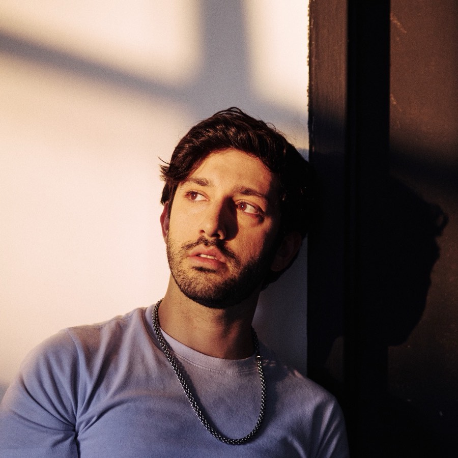 thinkin&rsquo; about you cover: Sam Haiman against a wall in raking window light